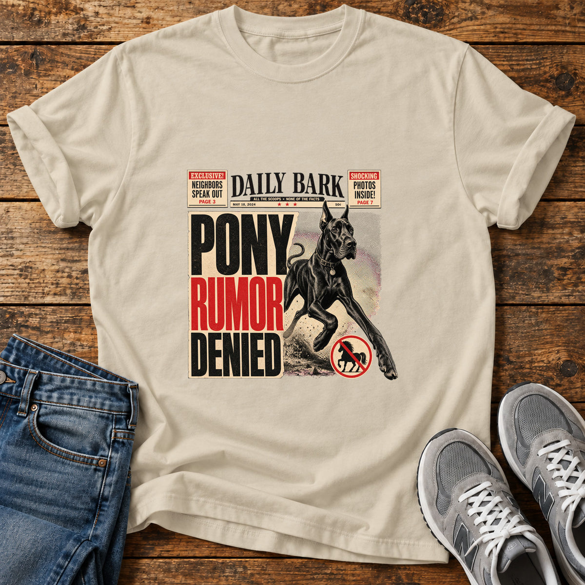Pony Rumor Great Dane graphic T-shirt in Sand, shown on a flat-lay shirt mockup