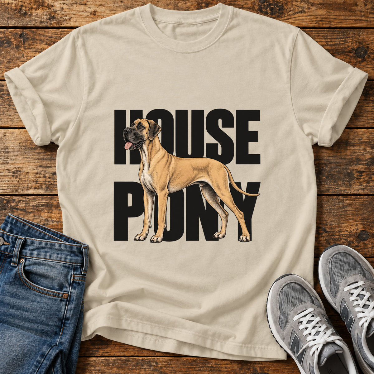 House Pony Great Dane graphic T-shirt in Sand, shown on a flat-lay shirt mockup