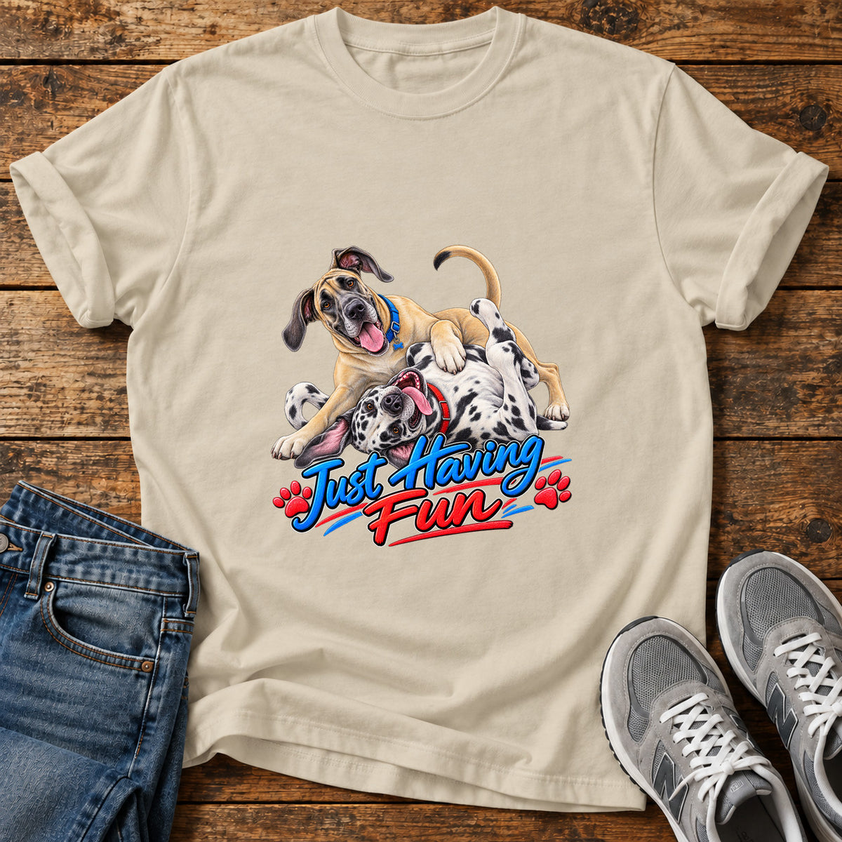 Just Having Fun Great Dane graphic T-shirt in Sand, shown on a flat-lay shirt mockup