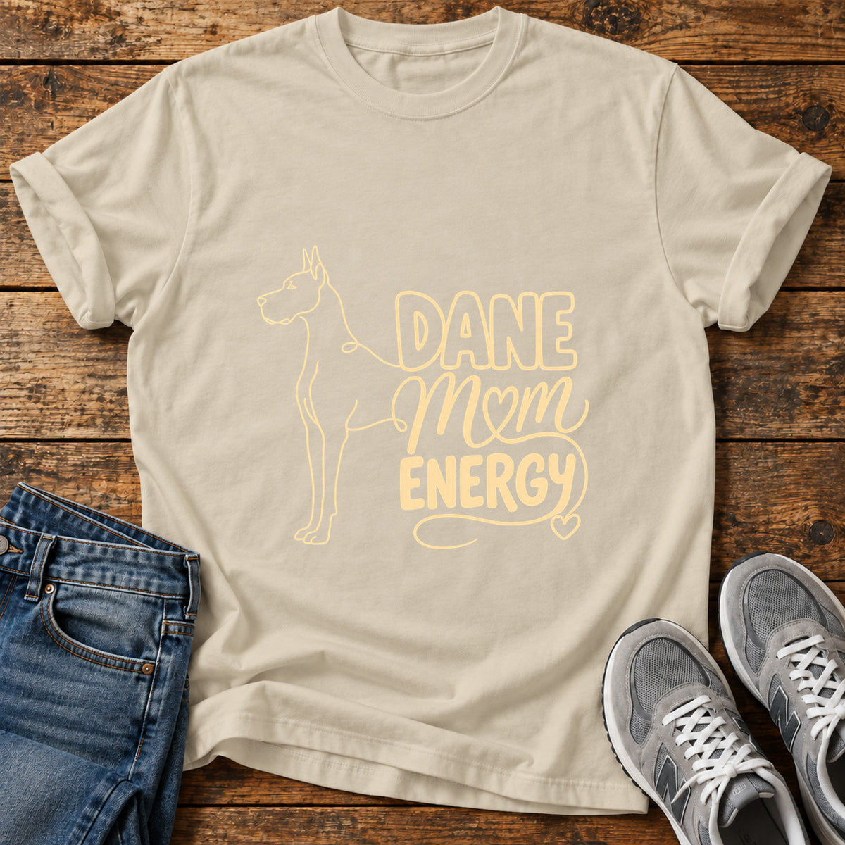 Dane Mom Vibes Great Dane graphic T-shirt in Sand, shown on a flat-lay shirt mockup