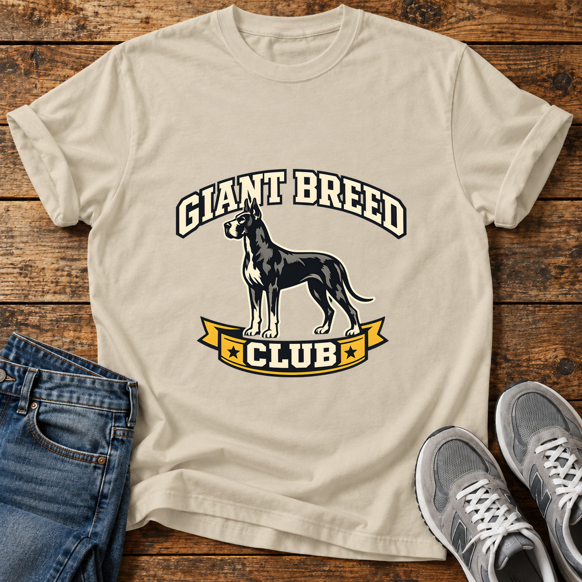Giant Breed Club Great Dane graphic T-shirt in Sand, shown on a flat-lay shirt mockup