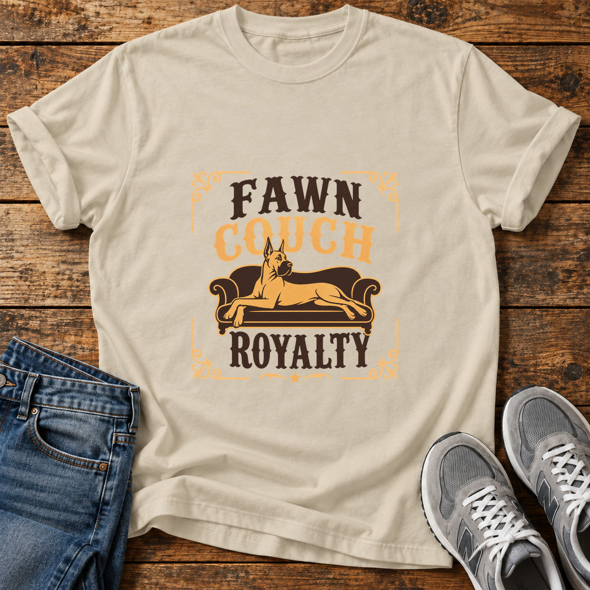 Fawn Couch Royalty Great Dane graphic T-shirt in Sand, shown on a flat-lay shirt mockup