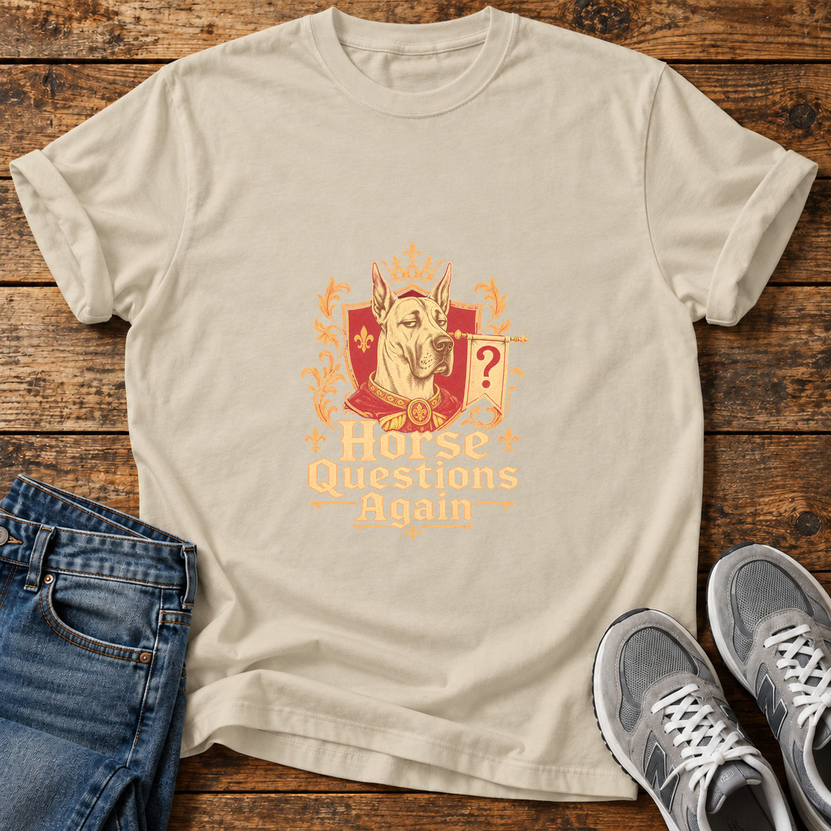 Horse Questions Again Great Dane graphic T-shirt in Sand, shown on a flat-lay shirt mockup