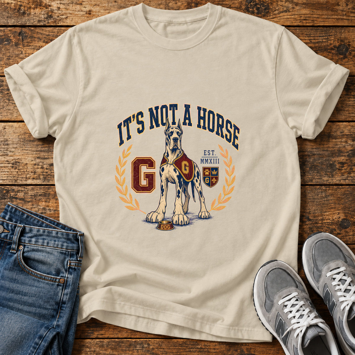 It's Not A Great Dane graphic T-shirt in Sand, shown on a flat-lay shirt mockup