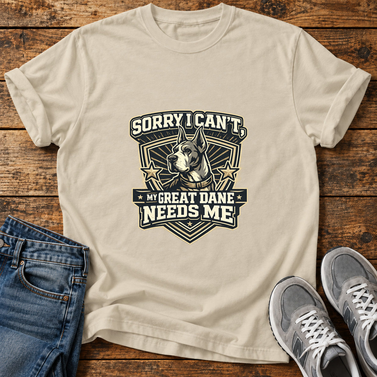 Sorry Great Dane graphic T-shirt in Sand, shown on a flat-lay shirt mockup