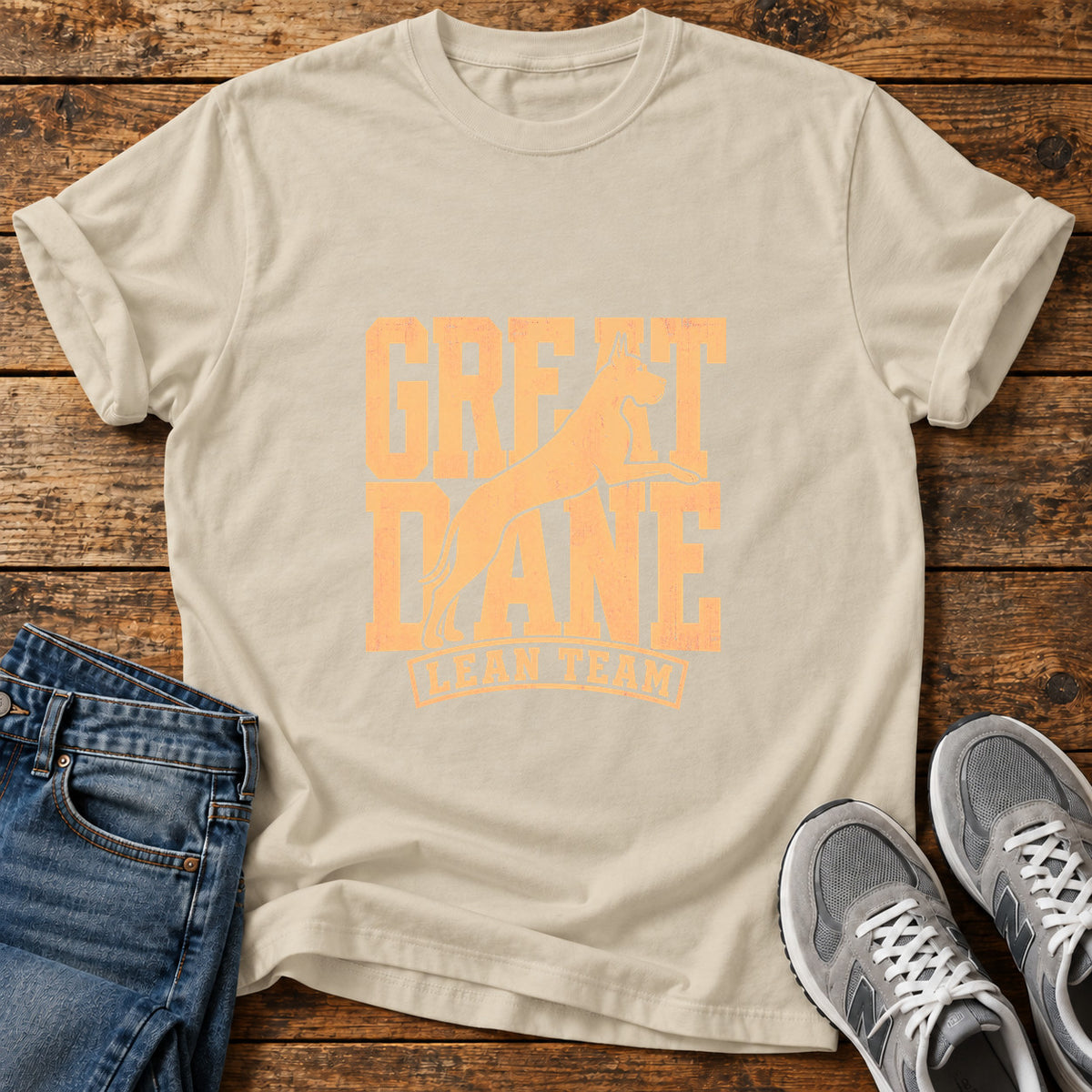 Great Dane Team graphic T-shirt in Sand, shown on a flat-lay shirt mockup