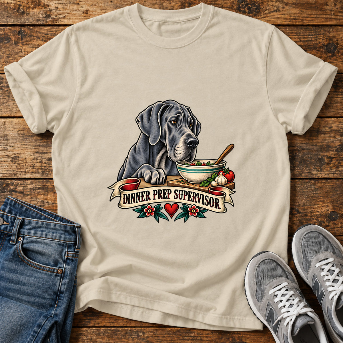 Dinner Prep Supervisor Great Dane graphic T-shirt in Sand, shown on a flat-lay shirt mockup
