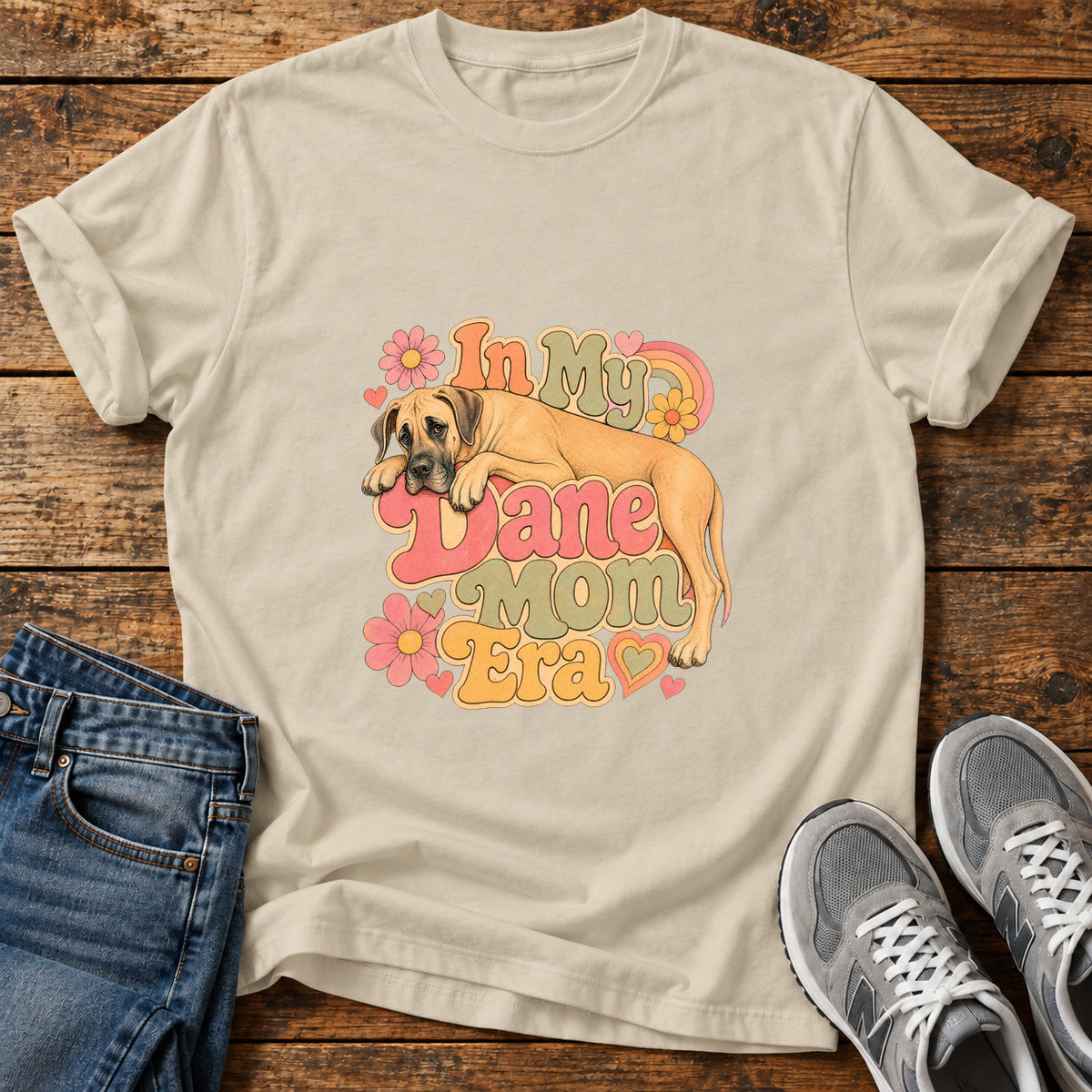 Dane Mom Era Great Dane graphic T-shirt in Sand, shown on a flat-lay shirt mockup