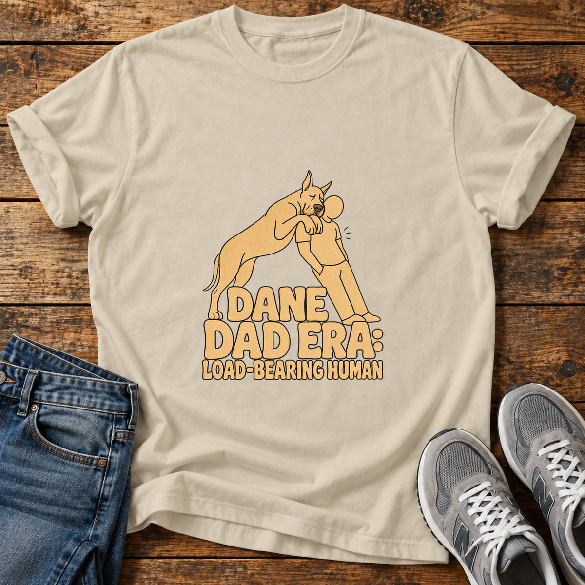 Dane Dad Era Great Dane graphic T-shirt in Sand, shown on a flat-lay shirt mockup