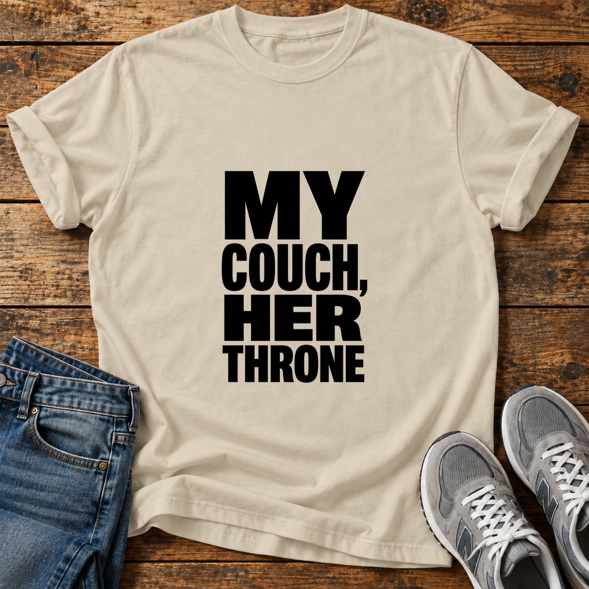 My Couch Throne Great Dane graphic T-shirt in Sand, shown on a flat-lay shirt mockup