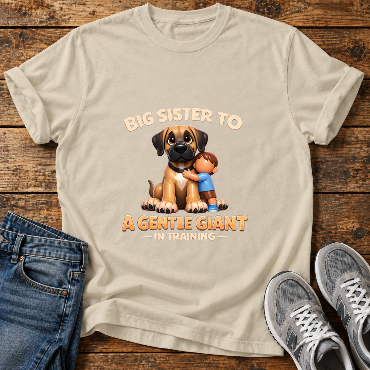 Gentle Giant Sister Great Dane graphic T-shirt in Sand, shown on a flat-lay shirt mockup