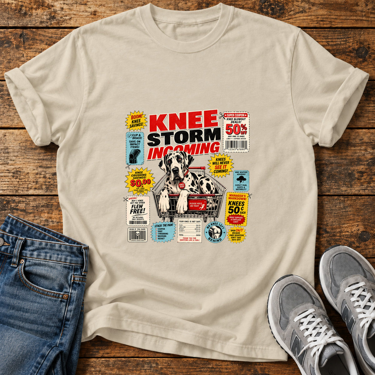 Knee Storm Incoming Great Dane graphic T-shirt in Sand, shown on a flat-lay shirt mockup
