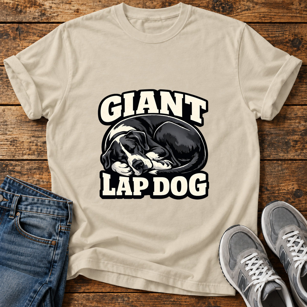 Giant Lap Dog Great Dane graphic T-shirt in Sand, shown on a flat-lay shirt mockup