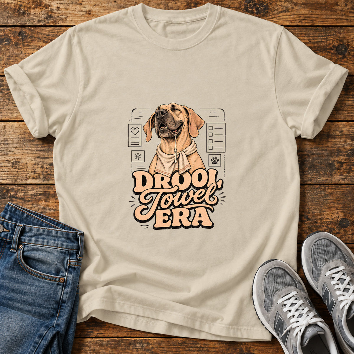 Drool Towel Era Great Dane graphic T-shirt in Sand, shown on a flat-lay shirt mockup