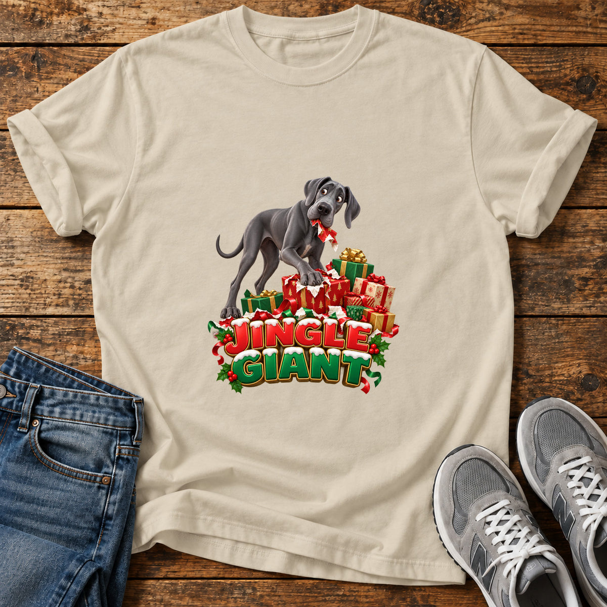 Jingle Giant Great Dane graphic T-shirt in Sand, shown on a flat-lay shirt mockup