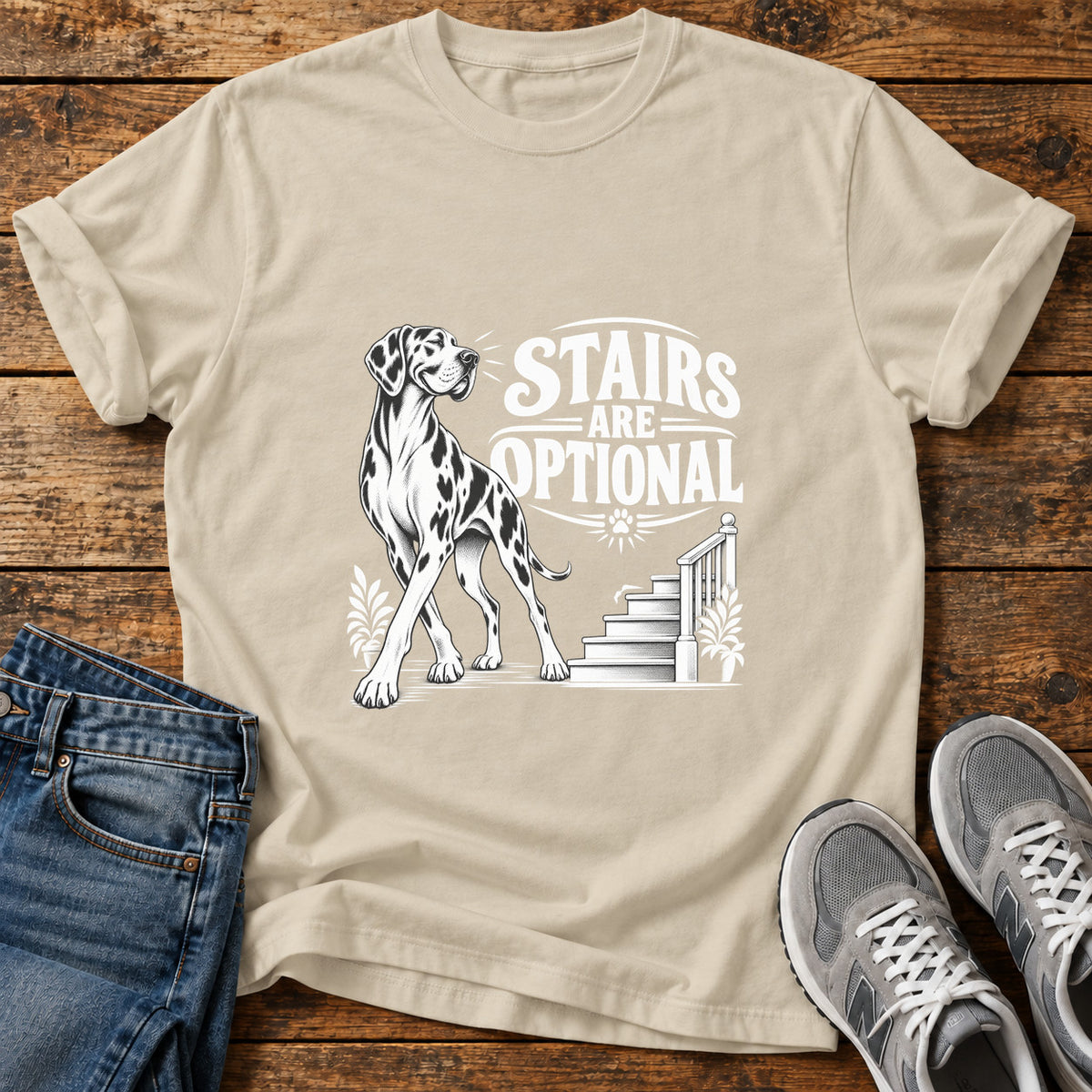 Stairs Optional Great Dane graphic T-shirt in Sand, shown on a flat-lay shirt mockup
