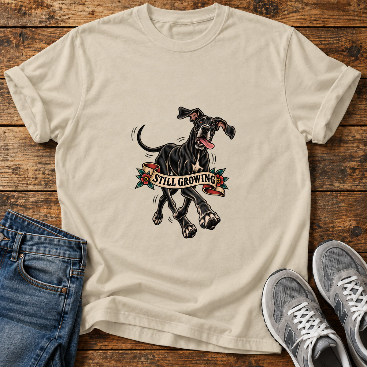Still Growing Great Dane graphic T-shirt in Sand, shown on a flat-lay shirt mockup