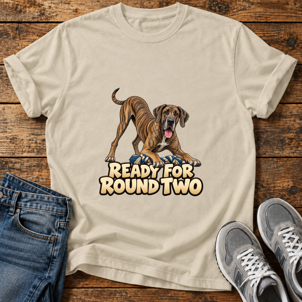 Ready For Round Great Dane graphic T-shirt in Sand, shown on a flat-lay shirt mockup