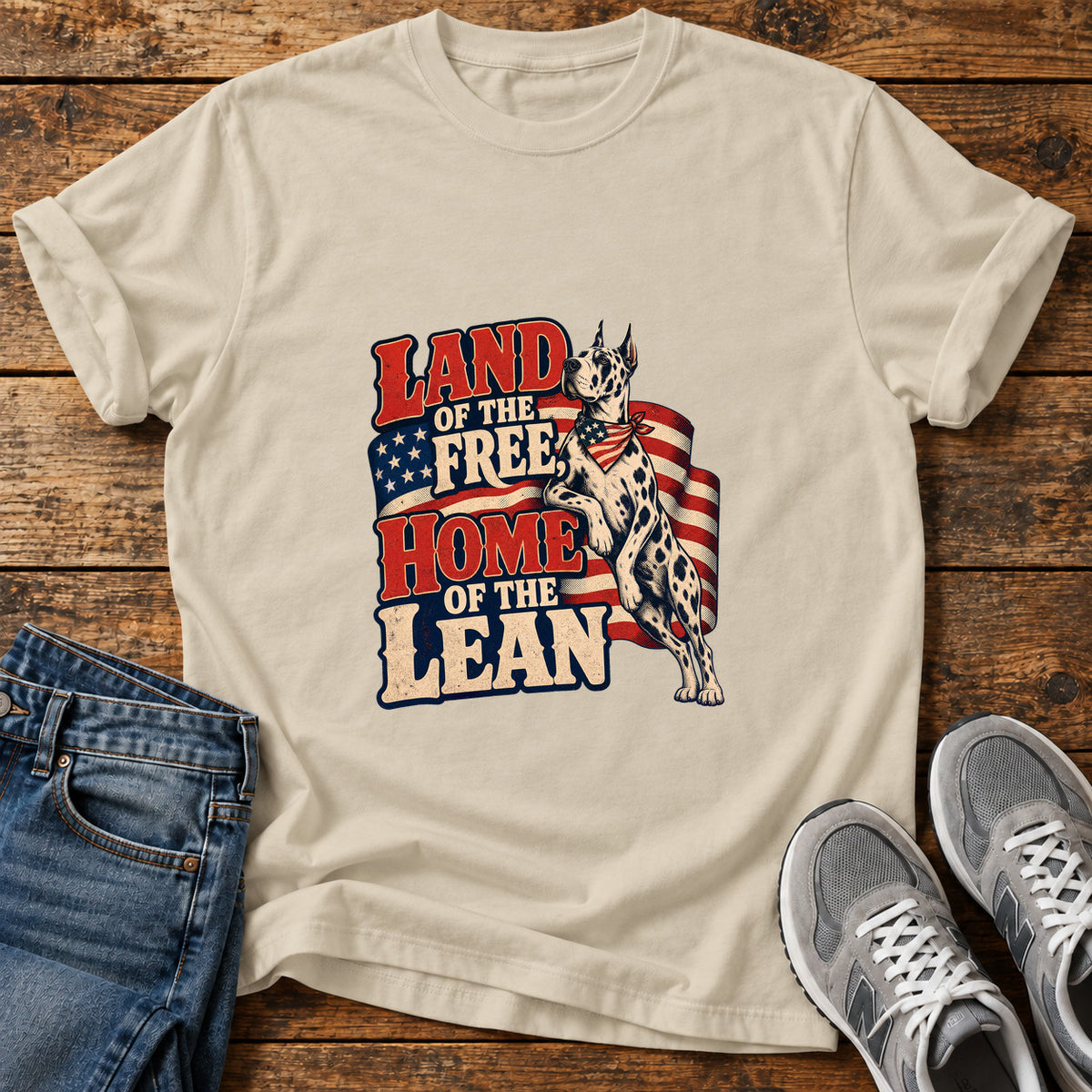 Land Of Lean Great Dane graphic T-shirt in Sand, shown on a flat-lay shirt mockup