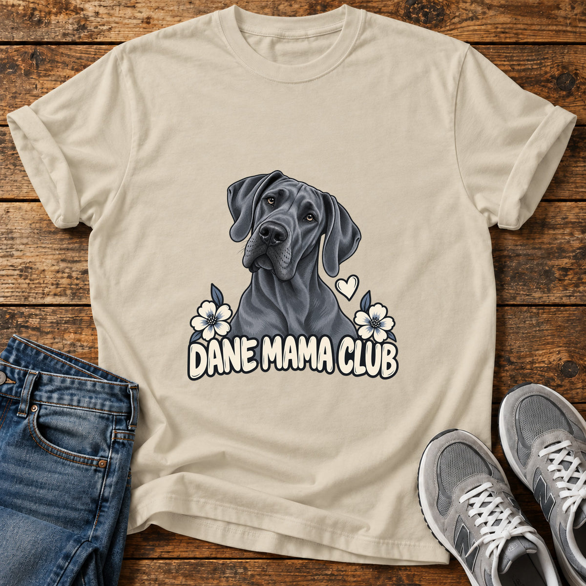 Dane Mama Club Great Dane graphic T-shirt in Sand, shown on a flat-lay shirt mockup
