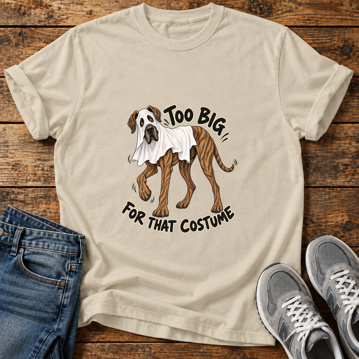 Too Big Costume Great Dane graphic T-shirt in Sand, shown on a flat-lay shirt mockup