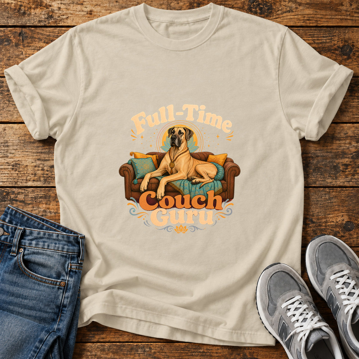 Couch Guru Great Dane graphic T-shirt in Sand, shown on a flat-lay shirt mockup