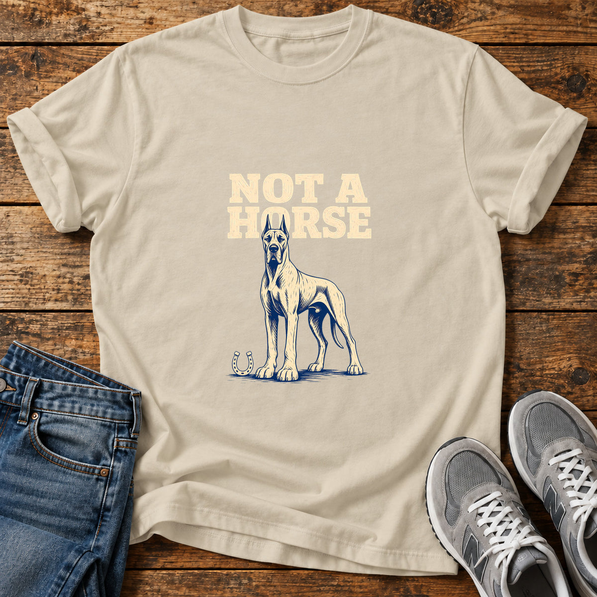 Not A Horse Great Dane graphic T-shirt in Sand, shown on a flat-lay shirt mockup