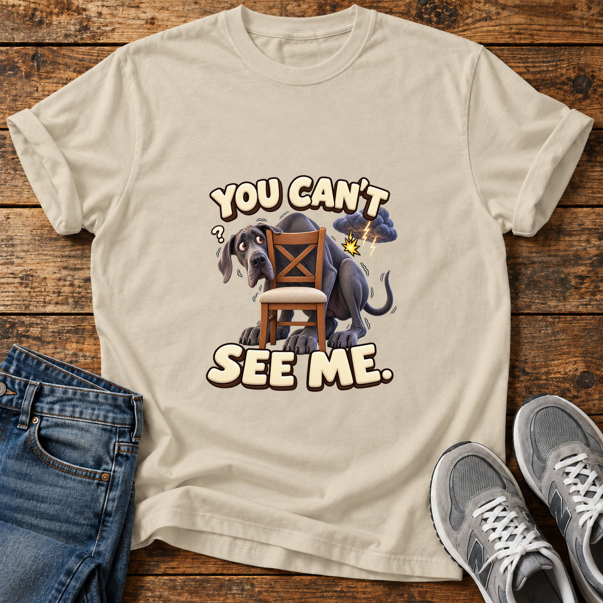 You Can't See Great Dane graphic T-shirt in Sand, shown on a flat-lay shirt mockup