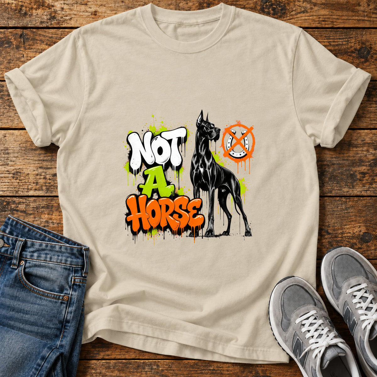 Not A Horse Great Dane graphic T-shirt in Sand, shown on a flat-lay shirt mockup