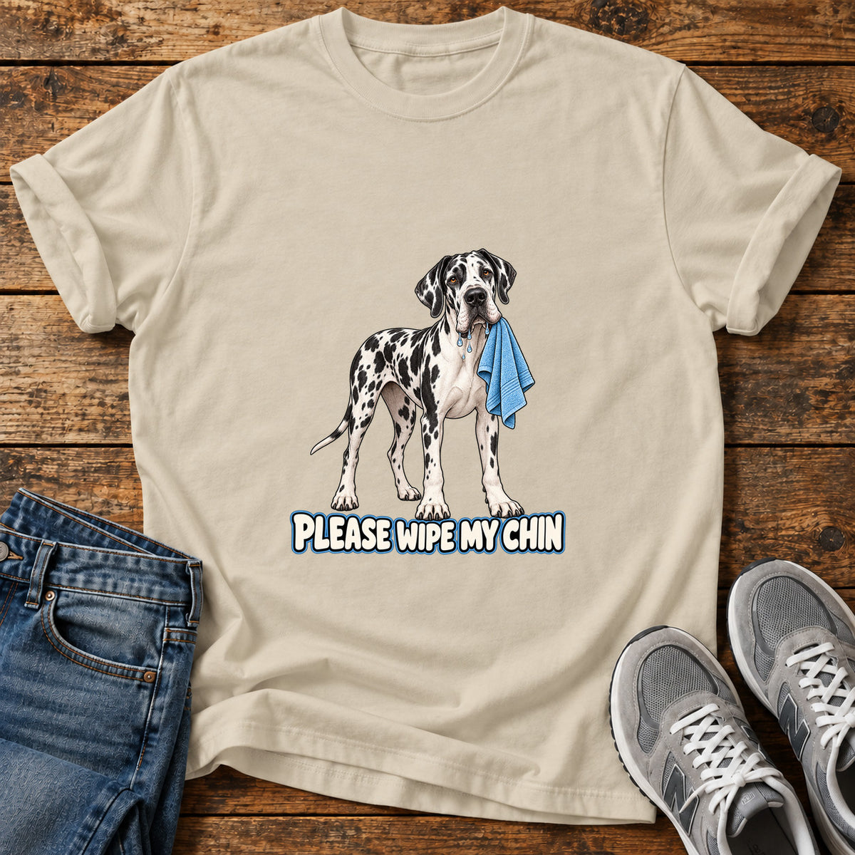 Wipe My Chin Great Dane graphic T-shirt in Sand, shown on a flat-lay shirt mockup