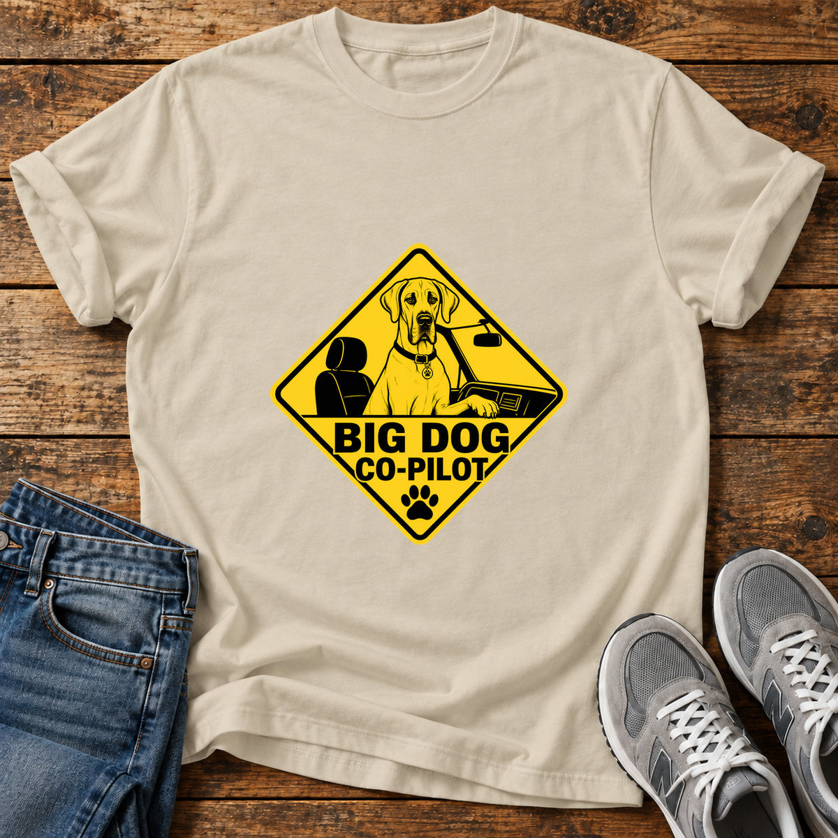Big Dog Co-Pilot Great Dane graphic T-shirt in Sand, shown on a flat-lay shirt mockup