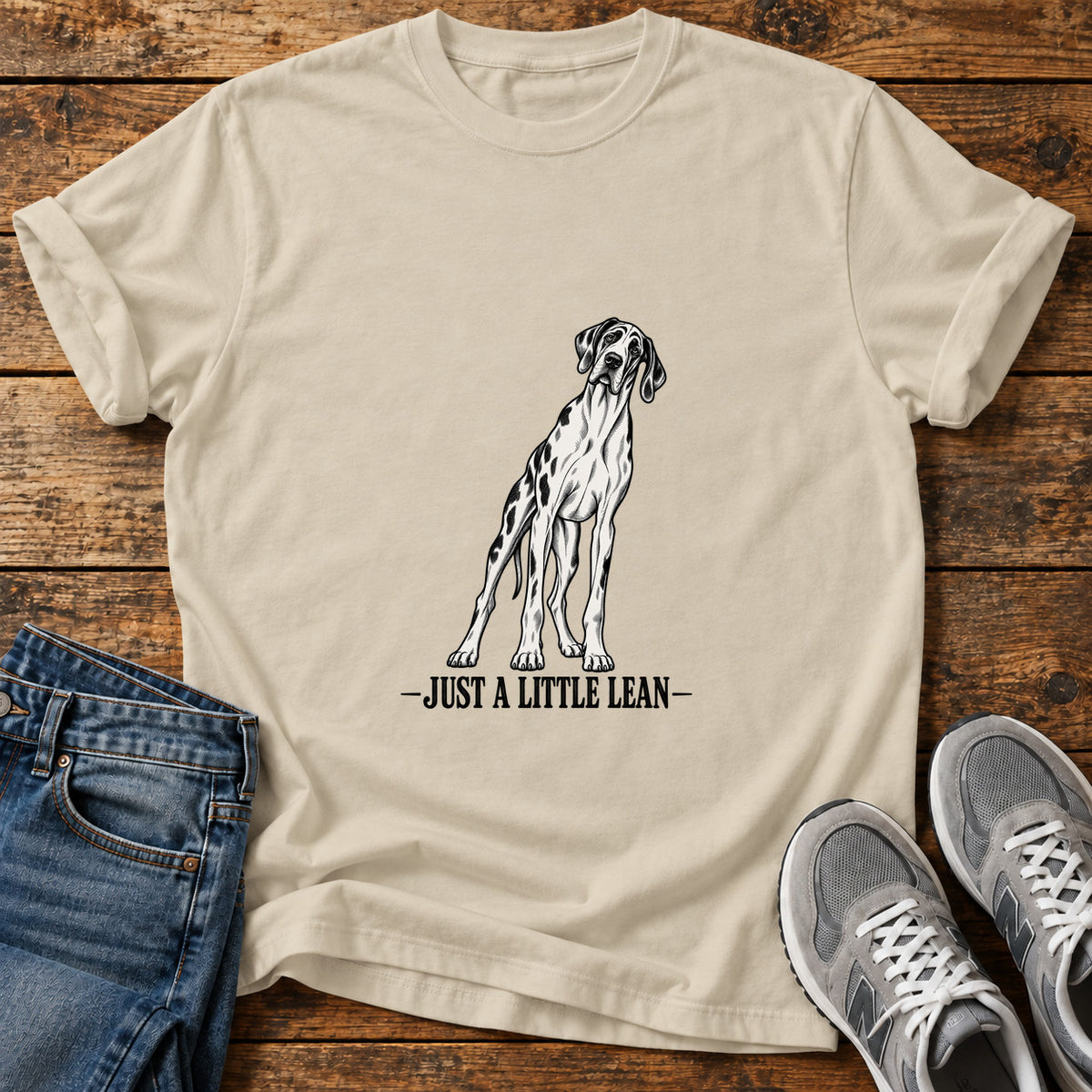 Just A Lean Great Dane graphic T-shirt in Sand, shown on a flat-lay shirt mockup