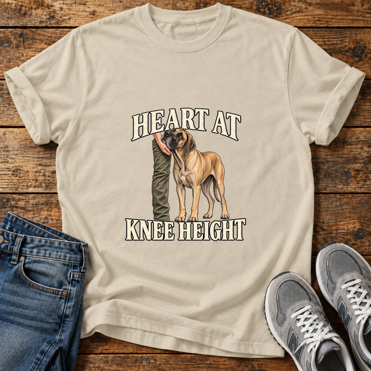 Heart at Knee Great Dane graphic T-shirt in Sand, shown on a flat-lay shirt mockup