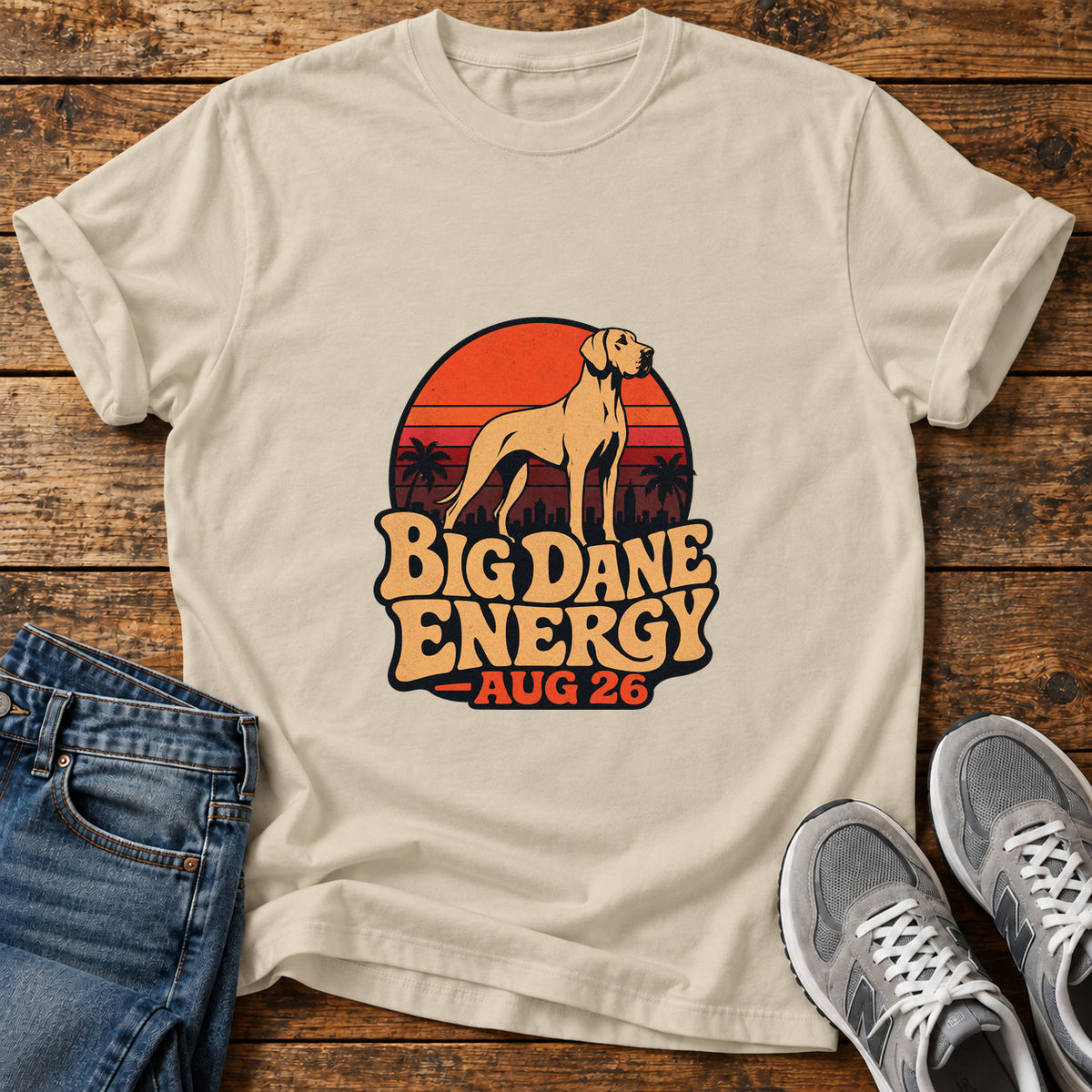 Big Dane Energy Great Dane graphic T-shirt in Sand, shown on a flat-lay shirt mockup