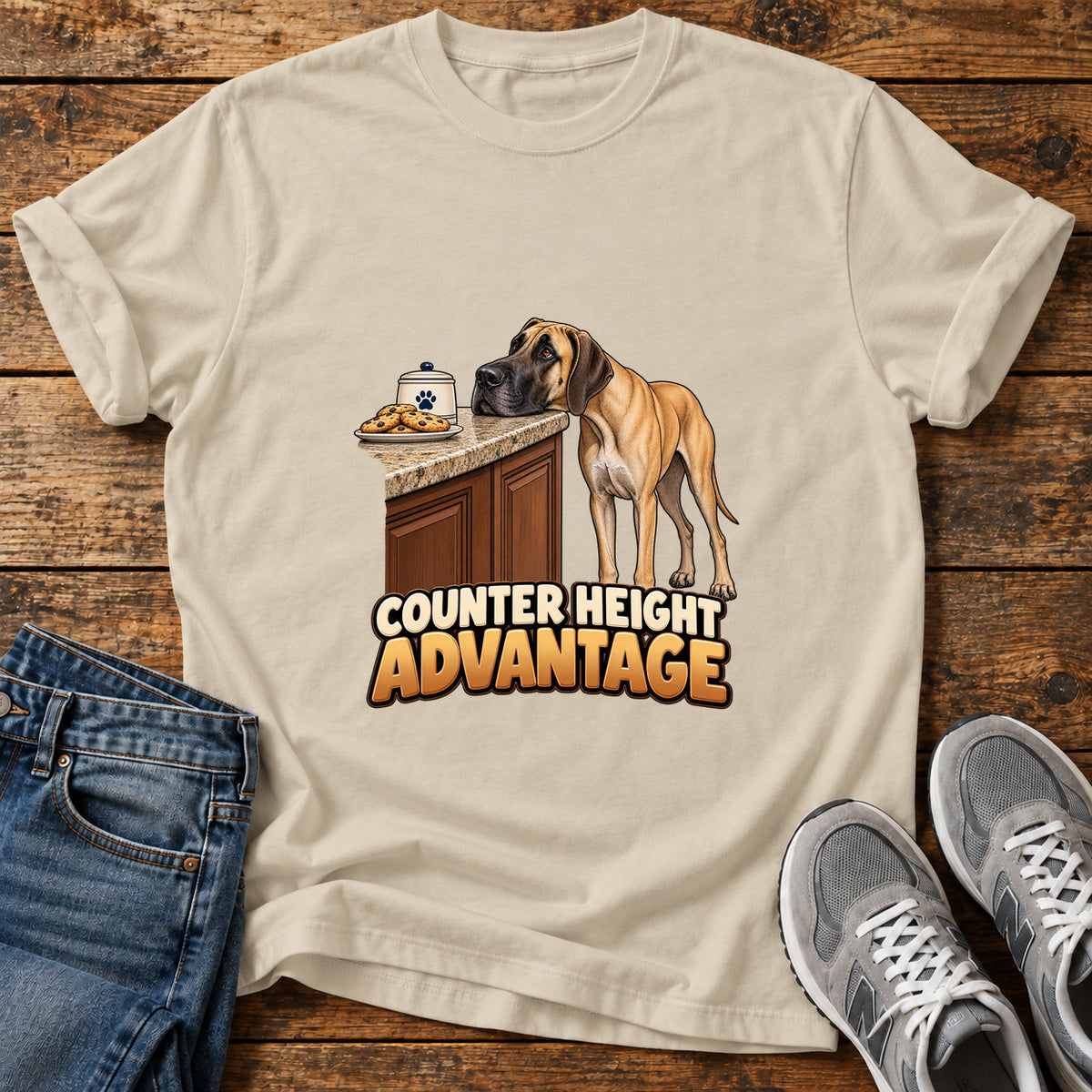 Counter Height Advantage Great Dane graphic T-shirt in Sand, shown on a flat-lay shirt mockup
