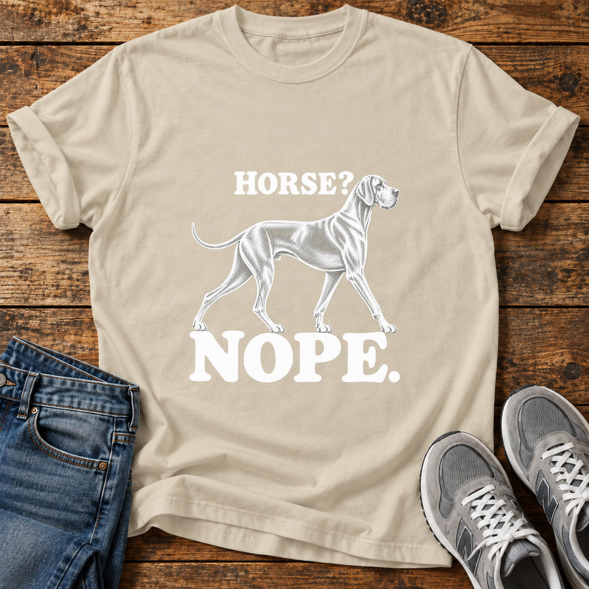 Horse Nope Great Dane graphic T-shirt in Sand, shown on a flat-lay shirt mockup