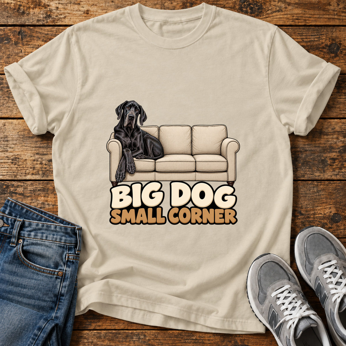 Big Dog Corner Great Dane graphic T-shirt in Sand, shown on a flat-lay shirt mockup