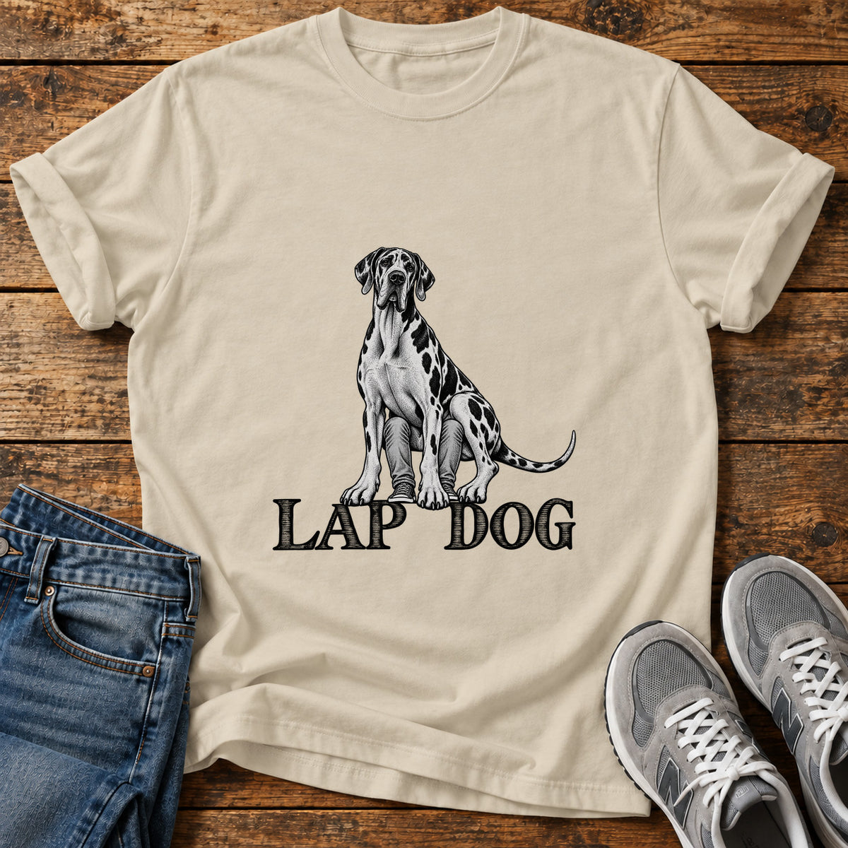 Lap Dog Great Dane graphic T-shirt in Sand, shown on a flat-lay shirt mockup