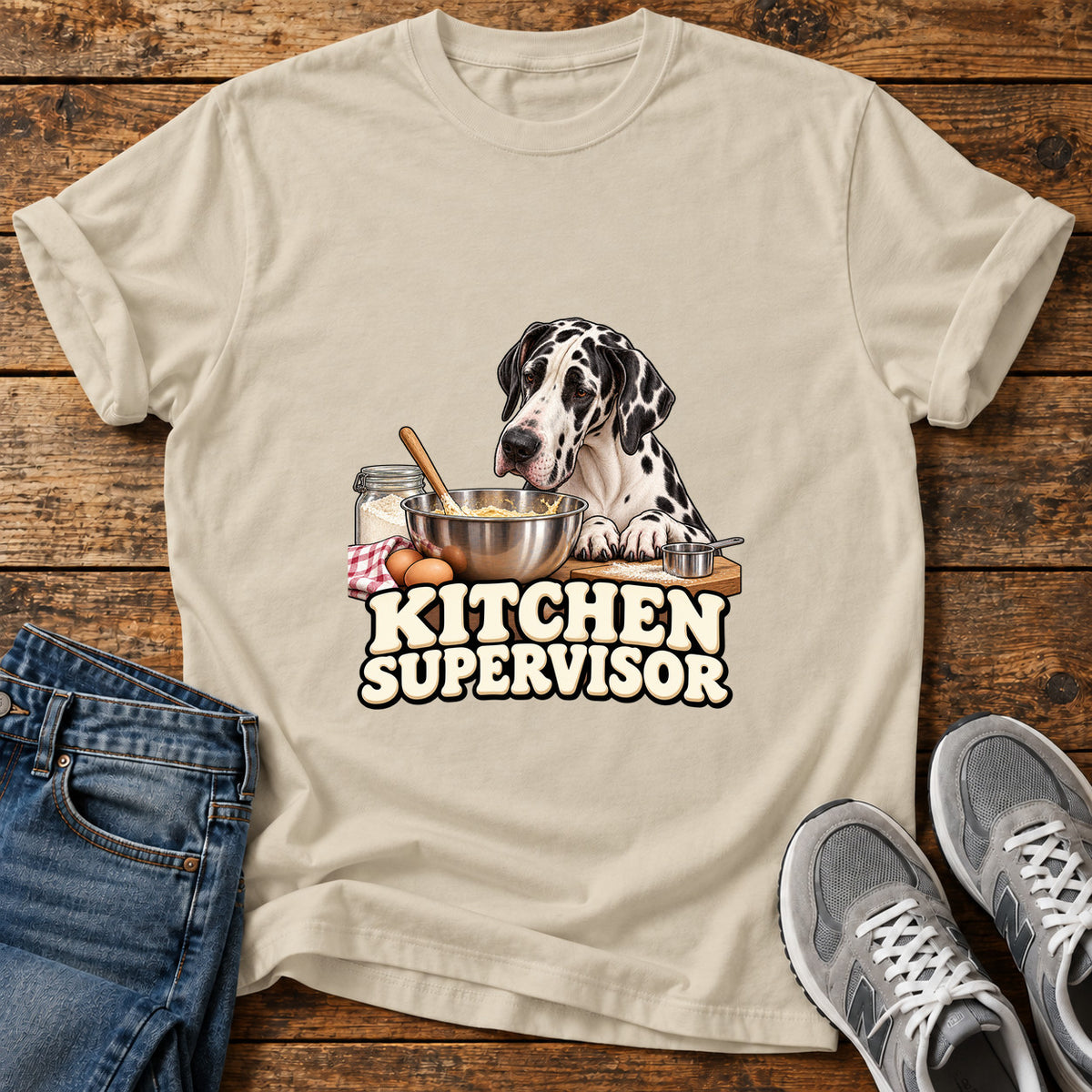 Kitchen Supervisor Great Dane graphic T-shirt in Sand, shown on a flat-lay shirt mockup