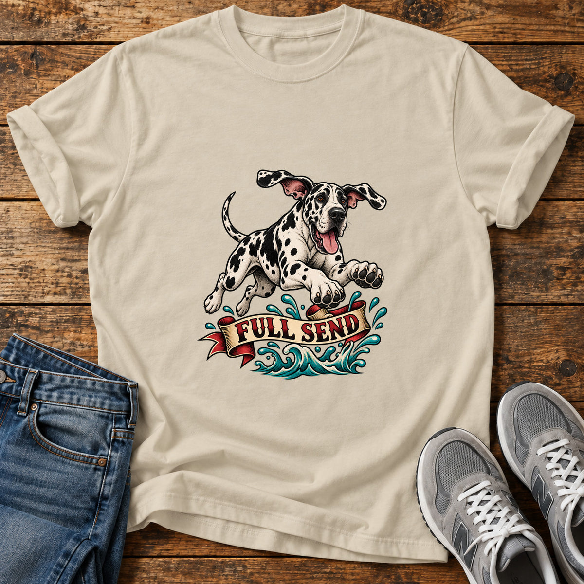 Full Send Pup Great Dane graphic T-shirt in Sand, shown on a flat-lay shirt mockup