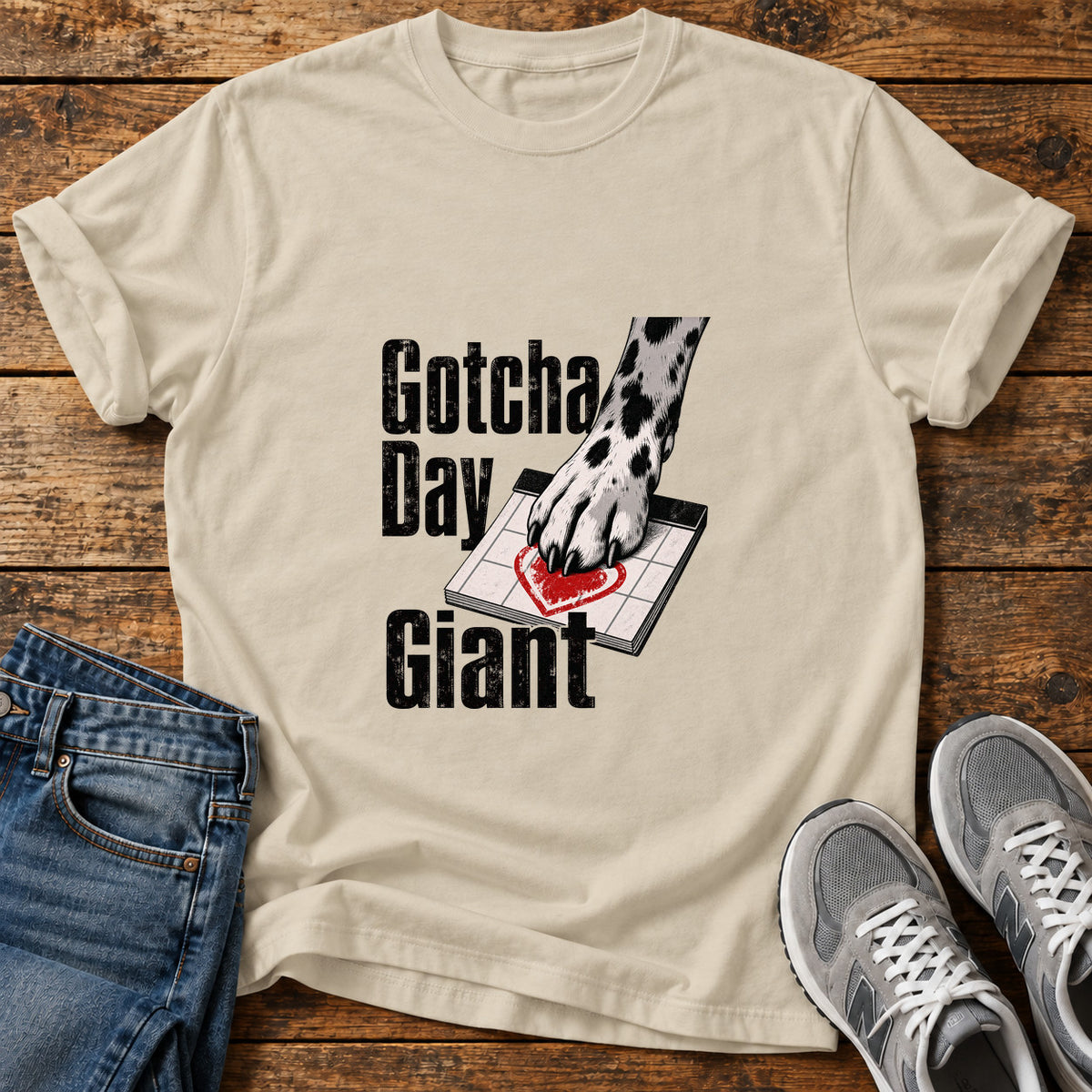 Gotcha Day Giant Great Dane graphic T-shirt in Sand, shown on a flat-lay shirt mockup