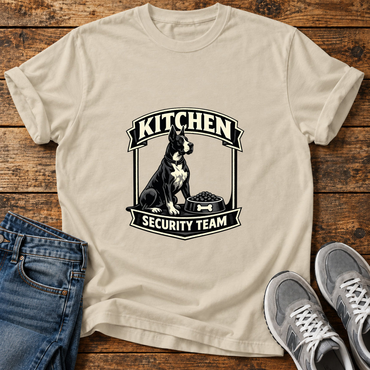 Kitchen Security Great Dane graphic T-shirt in Sand, shown on a flat-lay shirt mockup