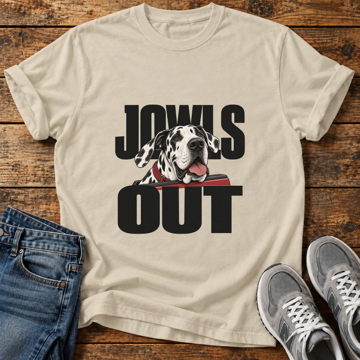 Jowls Out Great Dane graphic T-shirt in Sand, shown on a flat-lay shirt mockup