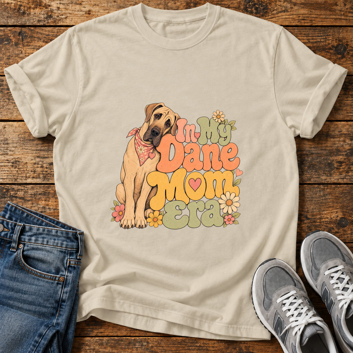 Dane Mom Era Great Dane graphic T-shirt in Sand, shown on a flat-lay shirt mockup