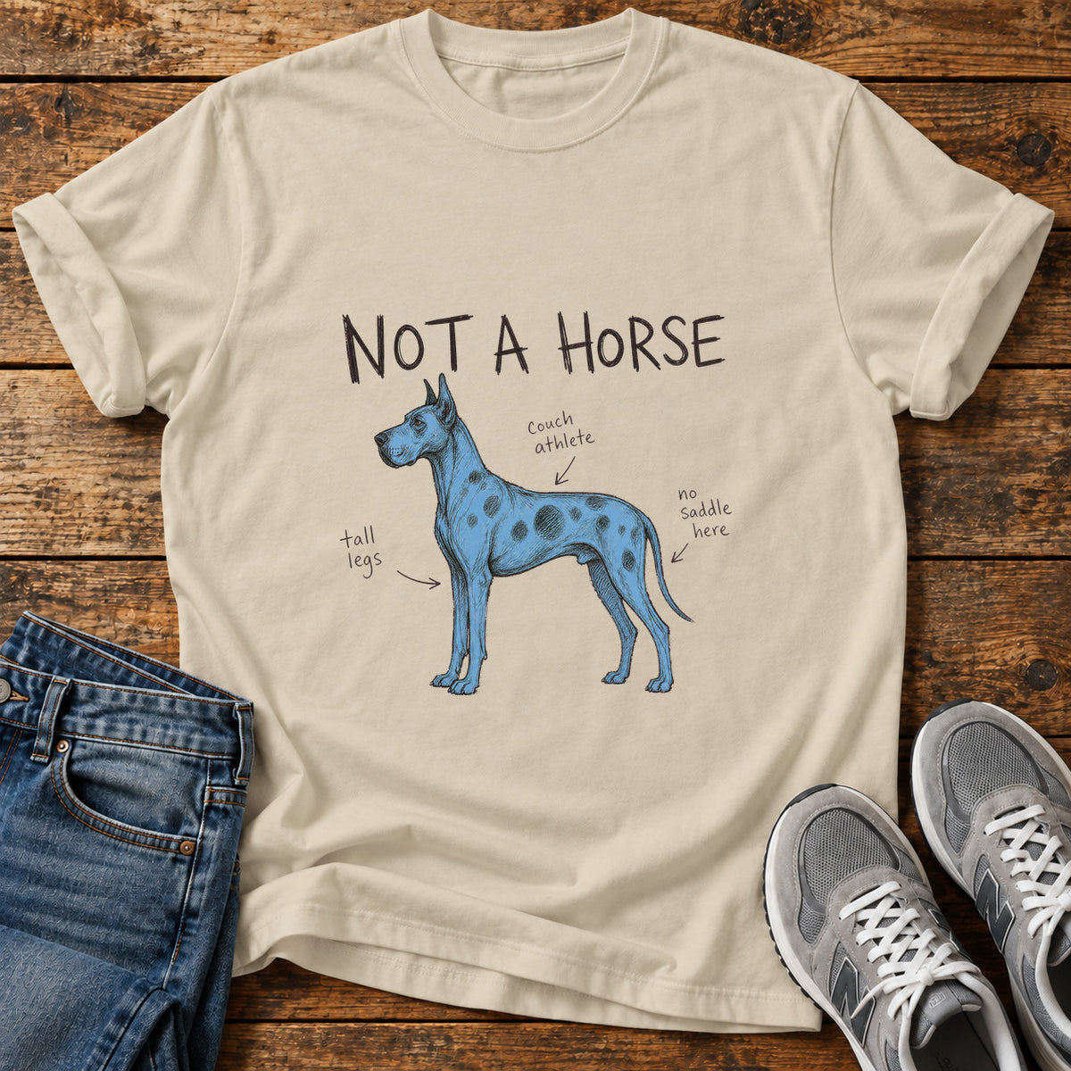 Not a Horse Great Dane graphic T-shirt in Sand, shown on a flat-lay shirt mockup