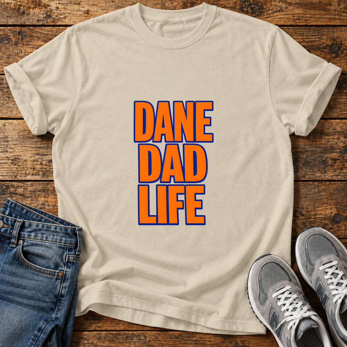 Dane Dad Life Great Dane graphic T-shirt in Sand, shown on a flat-lay shirt mockup
