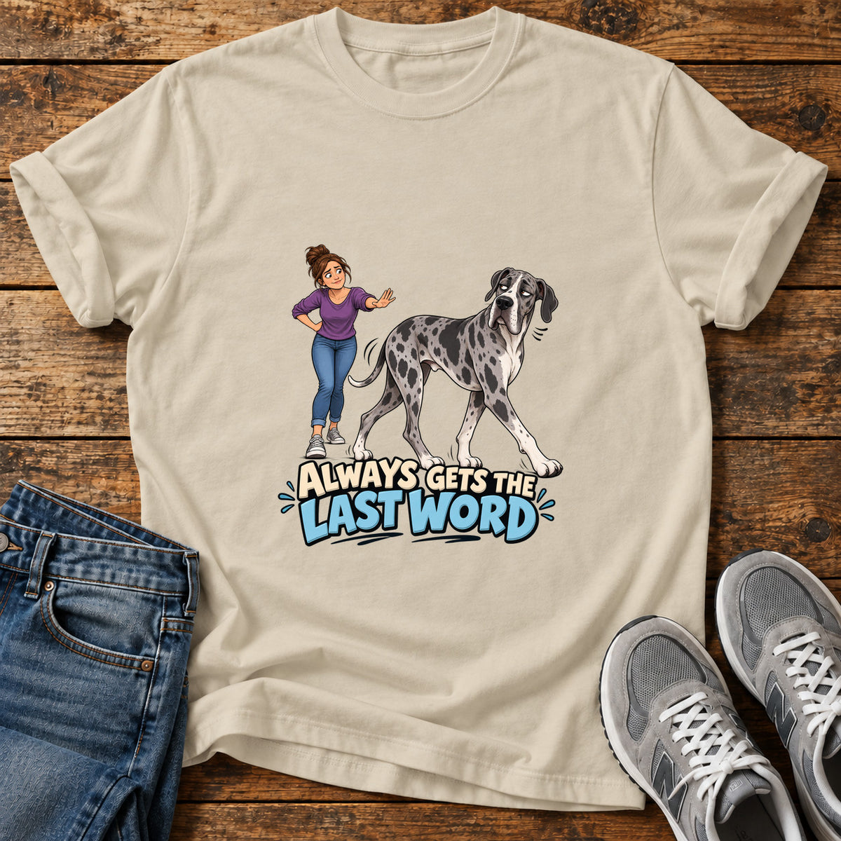Last Word Wag Great Dane graphic T-shirt in Sand, shown on a flat-lay shirt mockup