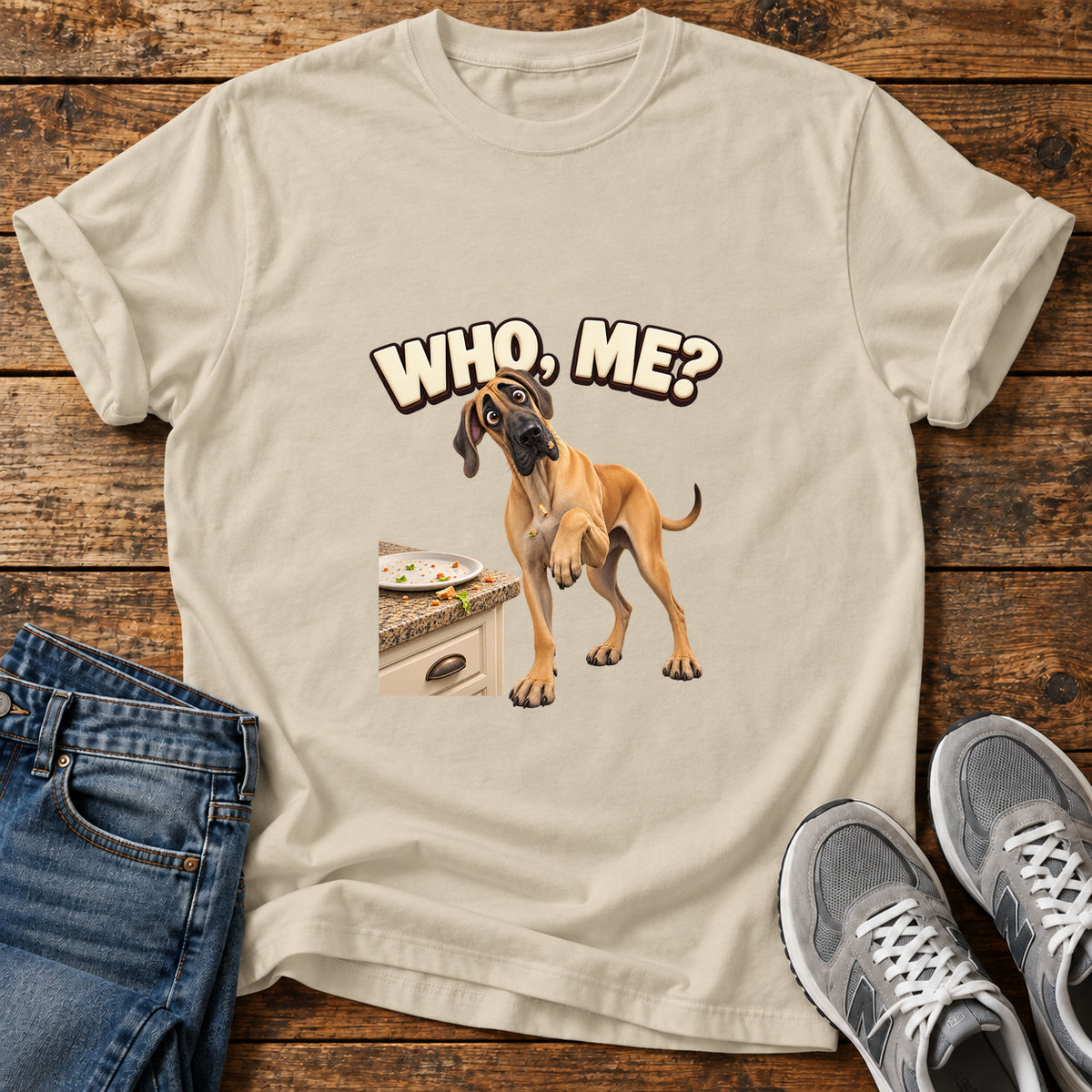 Who Me Great Dane graphic T-shirt in Sand, shown on a flat-lay shirt mockup