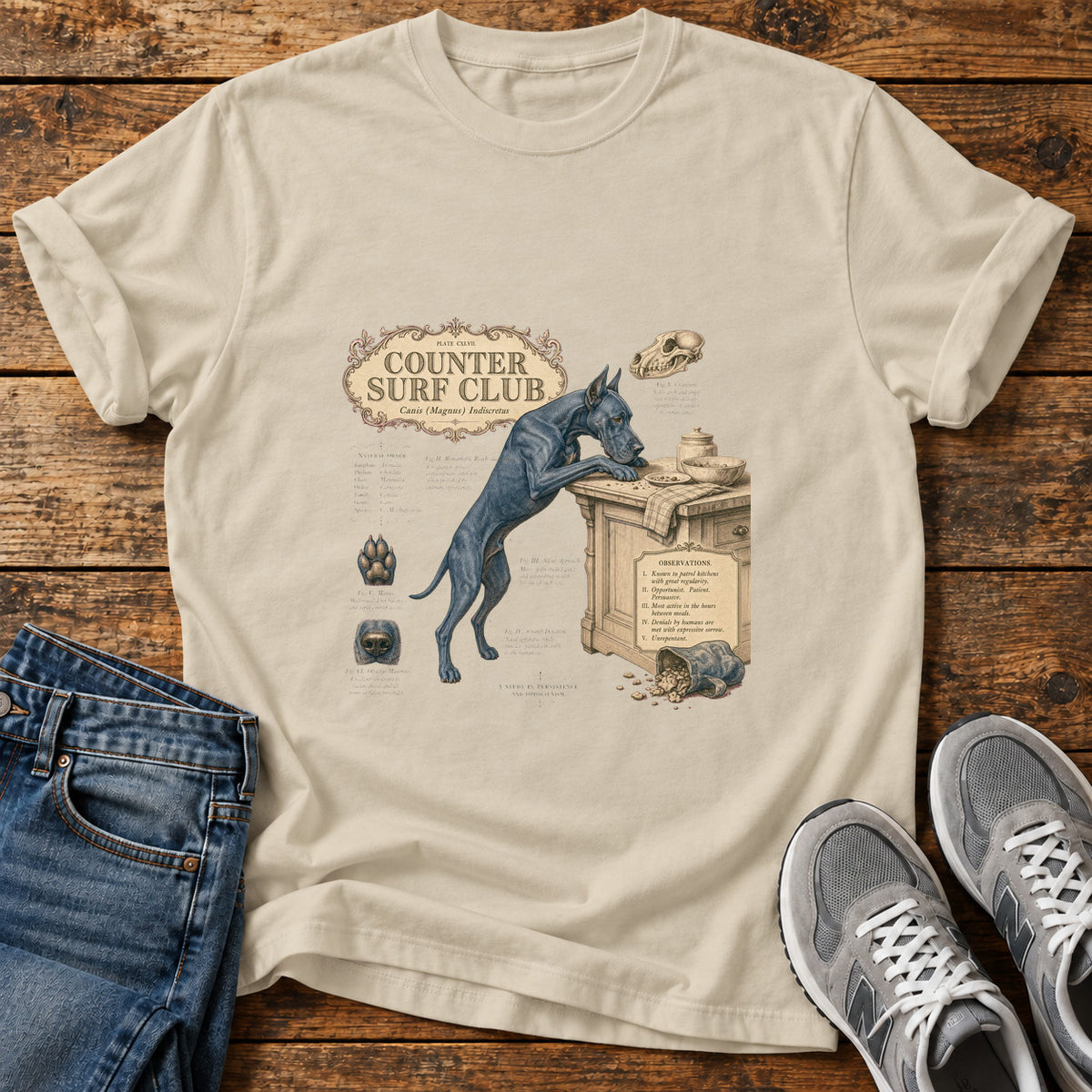 Counter Surf Club Great Dane graphic T-shirt in Sand, shown on a flat-lay shirt mockup