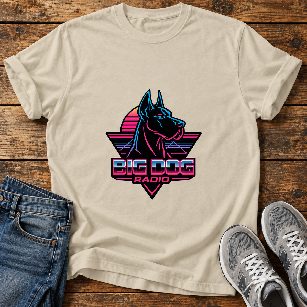 Big Dog Radio Great Dane graphic T-shirt in Sand, shown on a flat-lay shirt mockup
